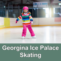 child skating in an arena wearing a helmet and winter gear