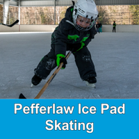 child in hockey gear at an outdoor rink with blue box that says Pefferlaw Ice Pad Skating